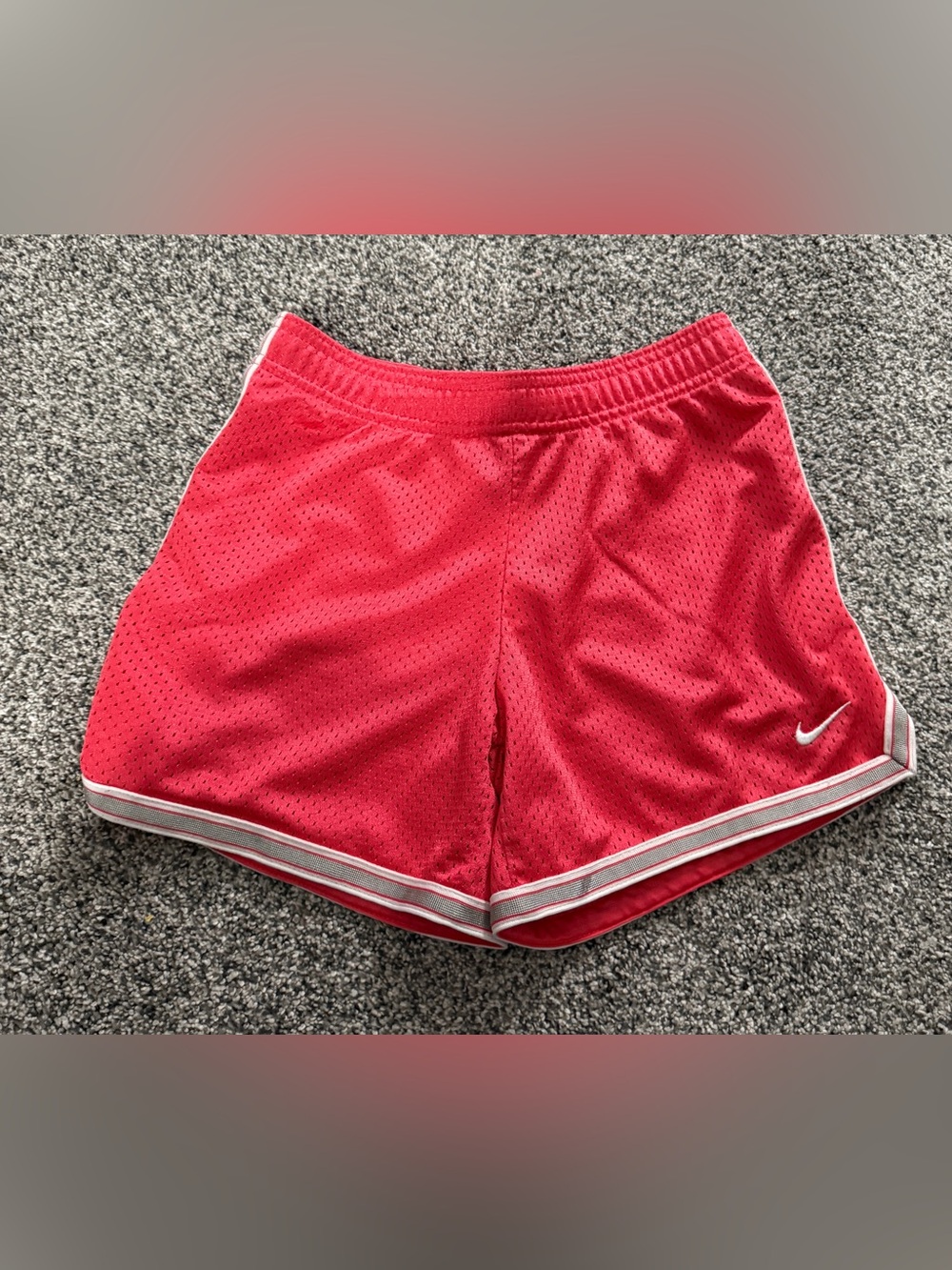 Nike pink/red shorts with white and gray striped hem, size S